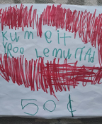 A sign made by a child for a lemonade sign. It reads "kum eit yroo lemurrad 50¢