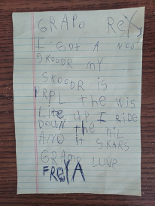 A letter written by a young child to her grandfather. Translation: Grandpa Rex, I got a new scooter. My scooter is purple. The wheels light up. I ride down the hill and it scares Grandma. Love, Freya.