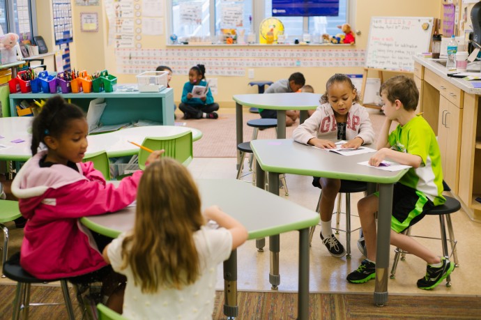 students at tables working together