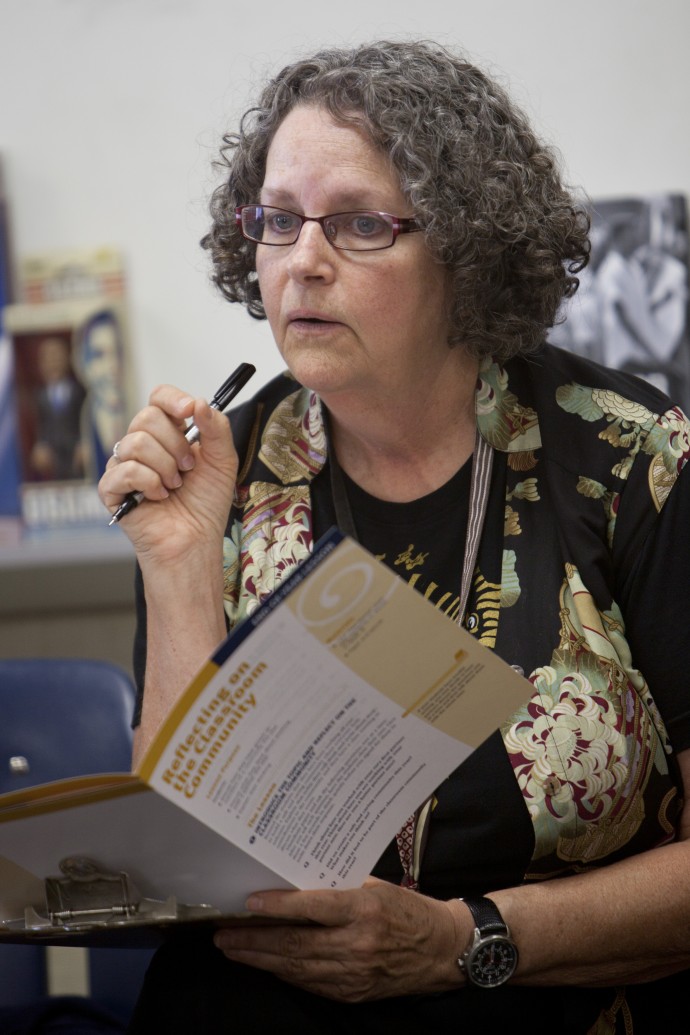 teacher with clipboard and pen