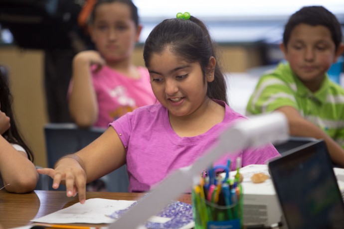 English language learner student at desk studying vocabulary