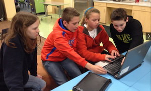 students working on a laptop