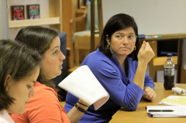 Isabel Mclean at table with teachers